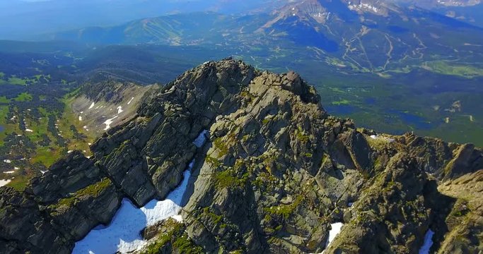 Close Flyover View Of Mountain Peak With Snow - Beehive Basin, Montana, USA