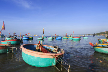 landscape with lots of colorful fishing boats in the Harbor on a blue sea
