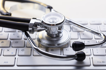 Medical Stethoscope On A Computer Keyboard