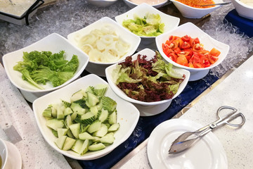 Healthy appetizing vegetable breakfast organic salad, tomato, onion, cucumber, dressing