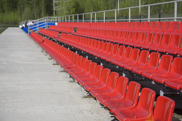 Fototapeta premium blue, red, white rows of seats on the stadium