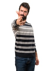 Fototapeta premium Man with beard making gun gesture