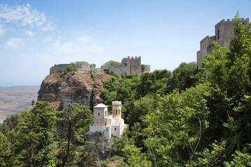 Erice, Sicily, Italy. In the foreground, Pepoli Castle, XIX century. In the background, the ruins of the castle of Venus, XII century