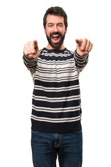 Naklejka premium Man with beard pointing to the front
