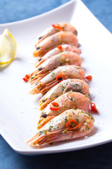 Shrimps fried with garlic and chili. Close-up, selective focus.