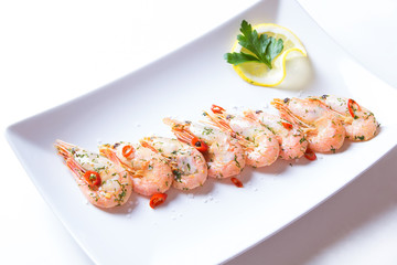 Shrimps fried with garlic and chili. Close-up, selective focus.