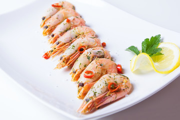 Shrimps fried with garlic and chili. Close-up, selective focus.