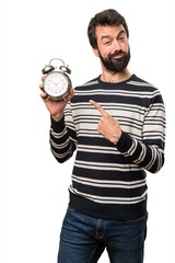 Happy Man with beard holding vintage clock