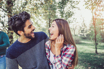 Obraz premium Happy couple in love having fun outdoors and smiling.