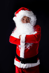 Portrait of Santa Claus standing on black background.