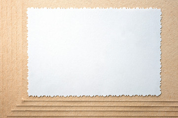 Sheet of paper and rough, textured cardboard