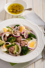 Healthy salad with tuna, eggs and broccoli.