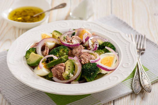 Healthy salad with tuna, eggs and broccoli.