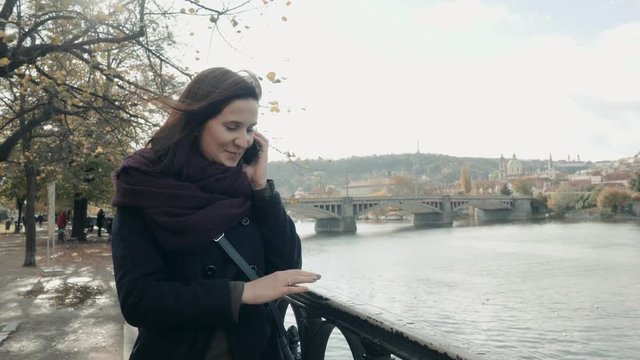Beautiful Young Woman Tourist In Prague Using Her Smartphone, Travelling Concept