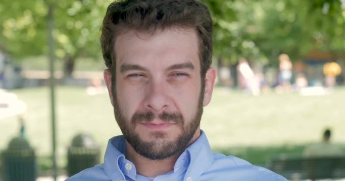 Exhausted tired millennial businessman yawning and wiping his eyes