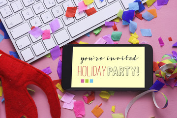 text you are invited holiday party in a smartphone