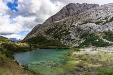 Fototapeta na wymiar mountain lake near the Fedaia Pass in the Italian Dolomites
