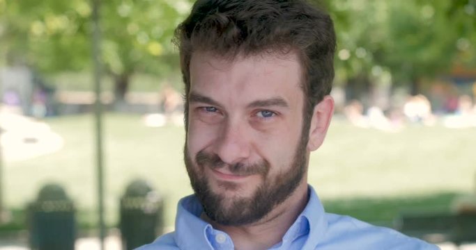 Man looking down and then showing he's unsatisfied by shaking his head no