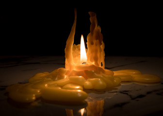 Closeup of a nearly burned down candle
