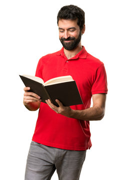 Handsome man reading a book