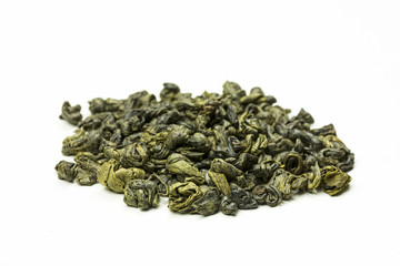 rolled green tea leaves on a white background
