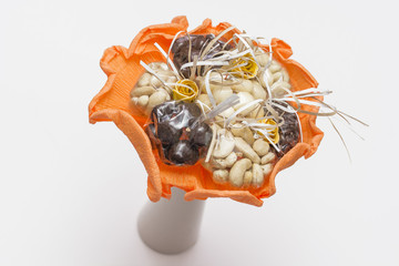 Bouquet with fruit in chocolate with orange trim.