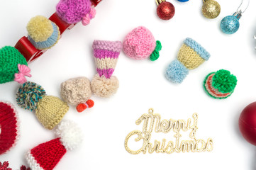 Merry christmas text, ball, fur hat, on white background