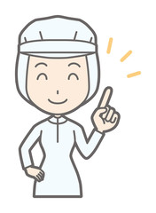 A female worker wearing white sanitary clothes is pointing with a smile