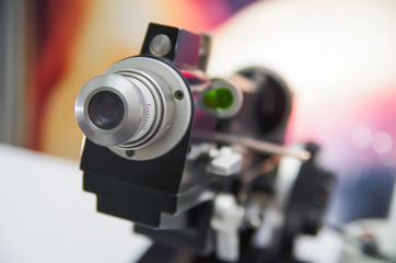 Fototapeta na wymiar Close up of modern equipment, eyes exam in optical, in a blurred background