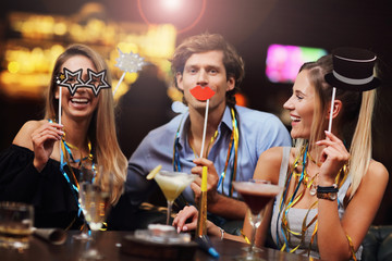 Group Of Friends Enjoying Drink in Bar