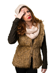 Frustrated girl with winter clothes