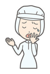 A female worker wearing white sanitary clothes is yawning