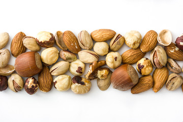 Assorted mixed nuts pattern isolated on white background. Top view


