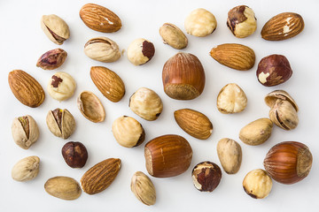 Assorted mixed nuts pattern isolated on white background. Top view

