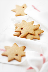 Fototapeta na wymiar Gingerbread cookies on kitchen towel