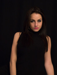Fototapeta premium Fashion close up portrait of young sexy beautiful brunette woman with professional makeup.Long hiair and smoky eyes,perfect skin.Hot Girl looking at camera