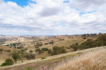 Australian outback landscape with hills and paddocks