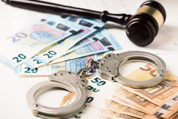 euro money and handcuff