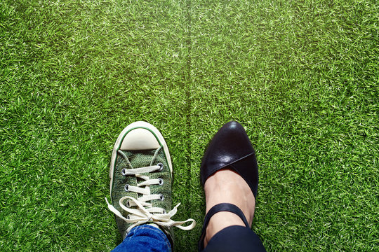 Life Balance concept for Work and Travel present in top view position over green grass field by half of Business Working Woman and Sneaker Shoes