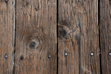 Aged worn timber boards from a pier - background texture