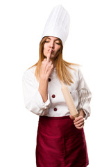 Beautiful chef woman making horn gesture