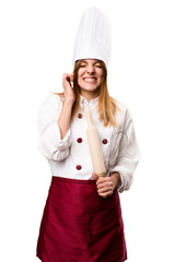 Beautiful chef woman covering her ears