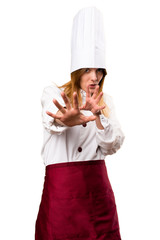 Frightened beautiful chef woman