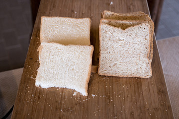 Sliced bread on wooden table