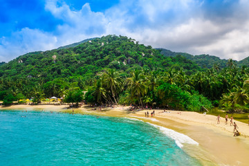 Aerial view of unidentified people enjoying the water of beach at Cabo San Juan,Tayrona Natural National Park, Colombia