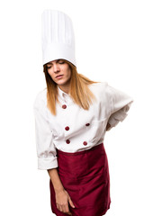 Beautiful chef woman with back pain