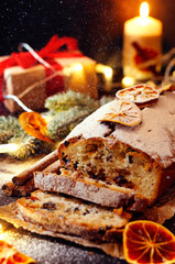Christmas fruitcake with festive decirations. Falling snowflakes