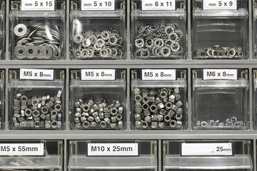 Nuts bolts and screws in boxes