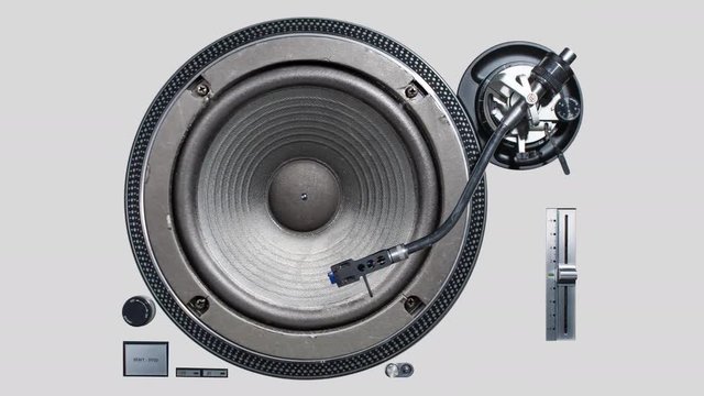 a cutout of a vinyl record player with a video of a pumping speaker in the middle of the plate