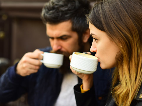 Couple in love drinks espresso during coffee break.